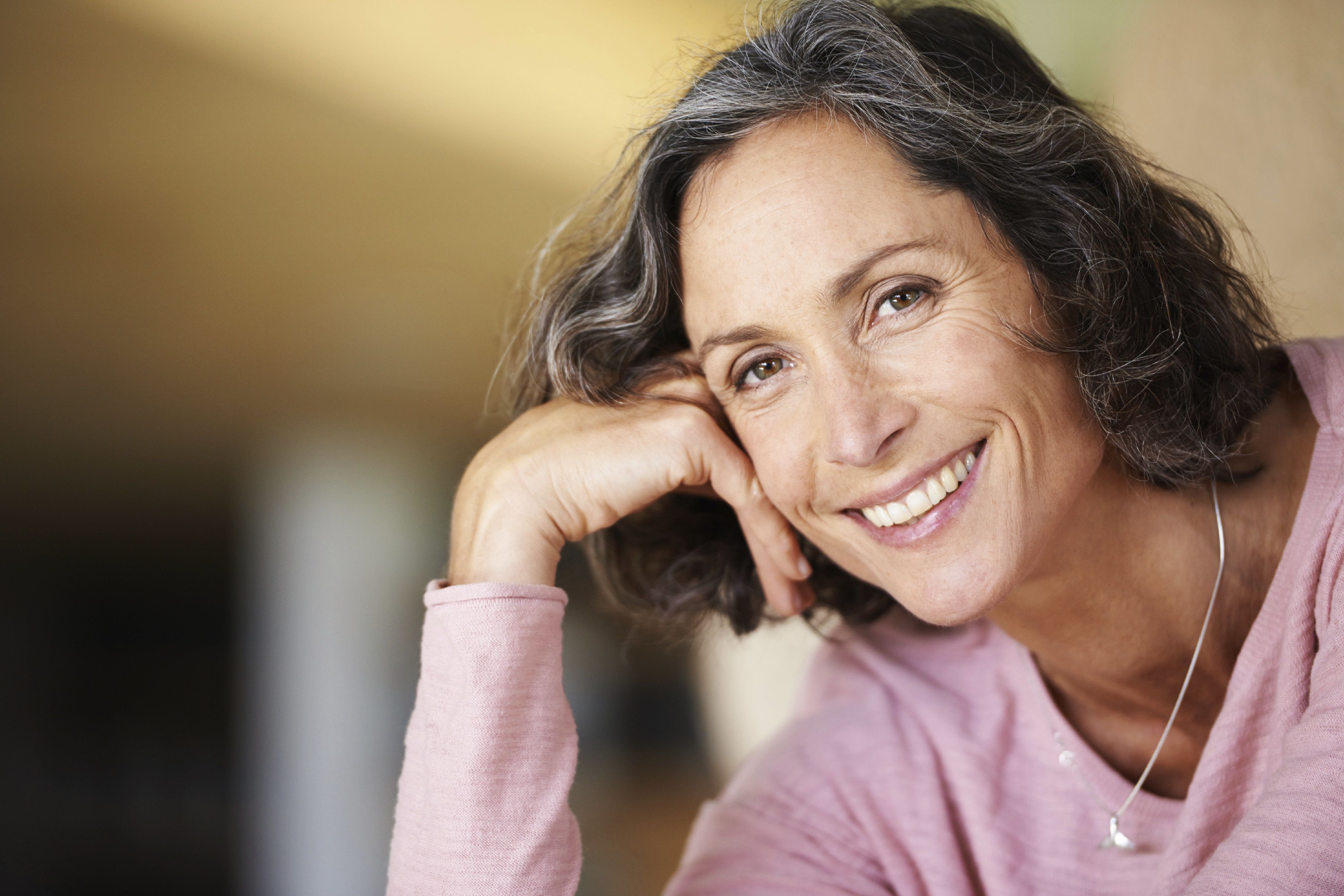 Smiling woman with black and silver hair