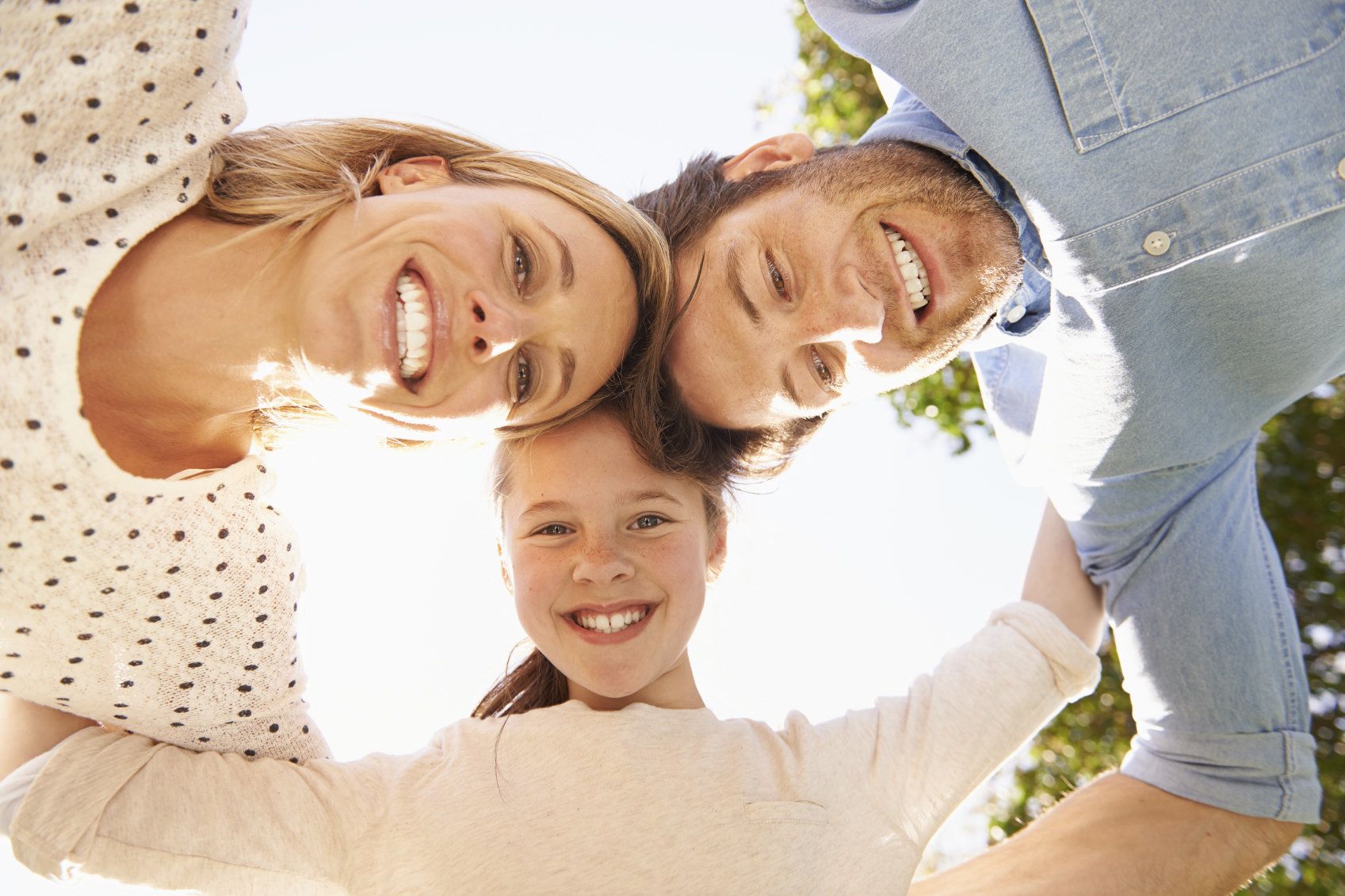 Family hugging in a circle.